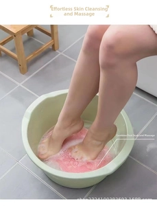 Pink silicone foot massage mat with textured scrubbing bristles inside a basin
