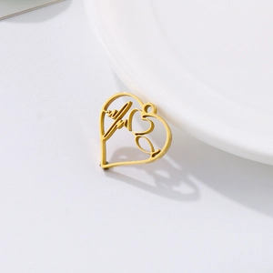 Minimalist golden stainless steel heart pendant featuring an ECG heartbeat line design