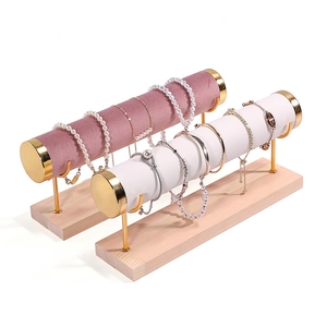 4-tier gold metal jewelry stand with wooden base and soft velvet display rods