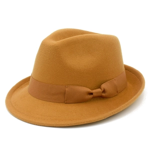 Detail of camel wool felt fedora hat featuring a matching ribbon bow and wide brim