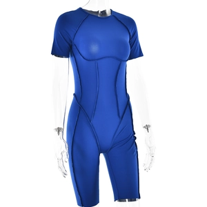 Detailed view of the backless blue romper featuring tight fit and contouring seams