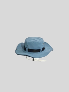 Detailed view of a blue outdoor sun hat with black ribbon and adjustable white chin strap