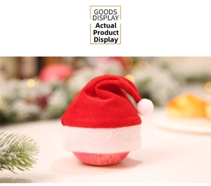 Close-up of a mini red velvet Christmas hat used as a festive apple gift wrap decoration