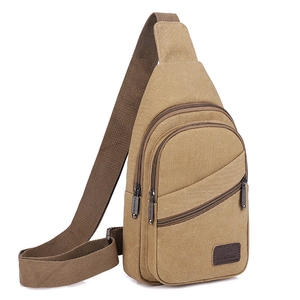 Brown canvas sling bag for men with multiple zipper compartments for outdoor travel use