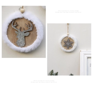 Detail of wooden Christmas ornament with silver reindeer and white faux fur trim decor