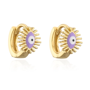 Close-up of gold-plated 18K copper huggie hoop earrings with purple evil eye enamel
