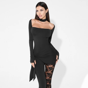 Close-up of black lace detail and asymmetric ruched hem on a sexy tight jumpsuit