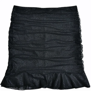 Detail of a black bodycon skirt with silver glitter dots and ruffled hemline