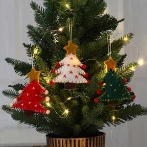 Handmade wool felt Christmas tree ornaments set in red, white and green with star toppers