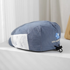 Close-up of baby elephant embroidery and breathable side mesh on blue sun hat