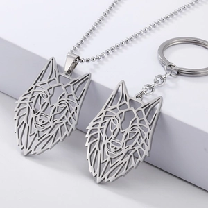 Detailed view of silver wolf head hollow necklace and keychain set with metallic finish