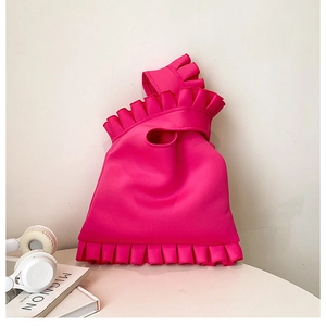 Detailed close-up of rose pink ruffled neoprene tote bag with integrated handle