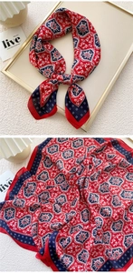 Detailed pattern of red and navy square scarf with classical kaleidoscope design