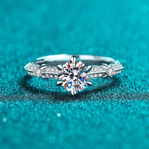 Elegant S925 sterling silver moissanite ring with six-prong setting on a teal background