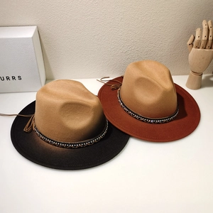 Detail of wool felt fedora hats with rhinestone bands and ethnic tassel accents