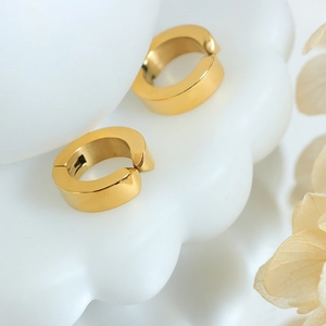 Minimalist 18k gold plated stainless steel non-pierced clip earrings on white ceramic base