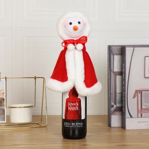 Detail of plush snowman wine bottle cover decoration for Christmas table settings