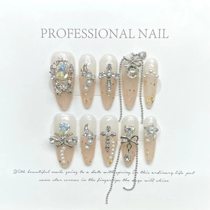 Fairy lace bow press-on nails with luxury rhinestones and pink gradient almond shape