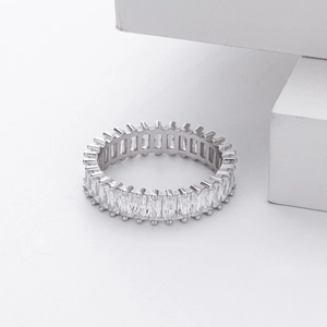 Macro detail of the full eternity band featuring rectangular clear zircon inlay in silver