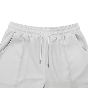 Close-up of waffle textured casual shorts with drawstring elastic waist and metal tips