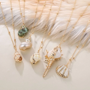 Gold-plated seashell and conch pendant necklaces on elegant minimalist bead chains