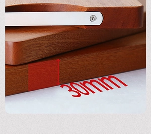 Detail of 30mm thick ebony wood cutting board with stainless steel reinforced edge