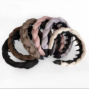 Detail of satin padded headbands with inner teeth showing various colors and textures
