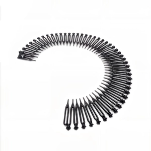 Detail of a flexible black zigzag elastic hair comb for styling and securing loose hair