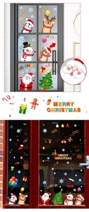 Close-up of Christmas window stickers with Santa and reindeer on glass background