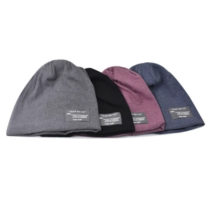Four-pack of minimalist knit beanies in grey, black, burgundy and navy with logo patches