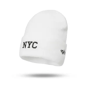 White knitted beanie with black NYC and 1987 embroidery for autumn and winter fashion