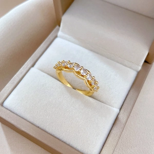 Elegant gold plated open ring with pavé cubic zirconia on velvet jewelry display