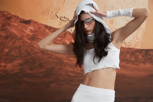 Close-up of white distressed knit Y2K streetwear set including hoodie and arm warmers