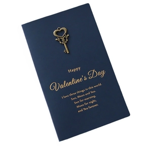 Vintage navy blue Valentine card with bronze key and gold foil love poem text