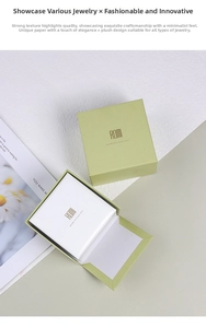 Detail view of matcha green jewelry gift box with plush white velvet interior lining