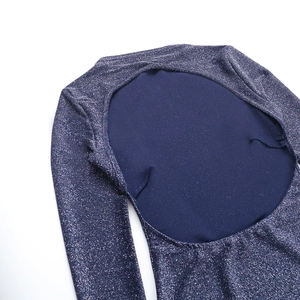 Detailed view of dark blue glitter fabric with silver silk thread and backless cut