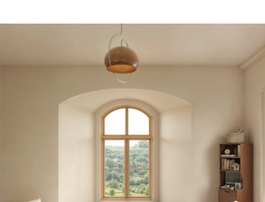 Close-up of semi-spherical amber glass pendant light with a metal frame in a warm room