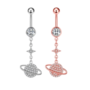 Detailed view of silver and rose gold planet belly rings with zircon inlays