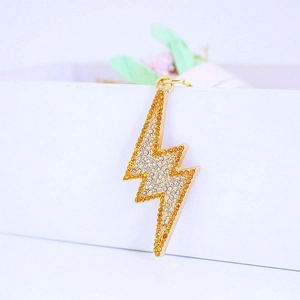 Flash lightning keychain with yellow and white rhinestones on gold frame
