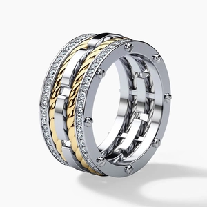 Detailed view of bicolor industrial ring with cable texture, screw heads and small crystals