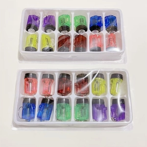 Top view of two boxes with twelve colorful LED finger lights in assorted vibrant colors