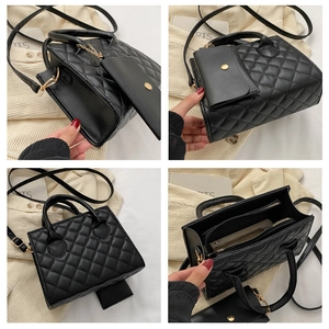 Detail of black quilted faux leather crossbody bag with matching coin purse accessory