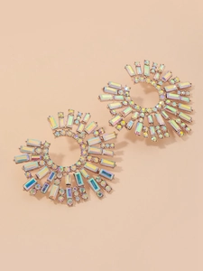 Macro view of crystal sunflower earrings with iridescent rhinestones in gold setting
