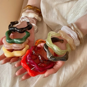 Chic irregular wavy acrylic resin bangles in multiple vibrant colors for modern women