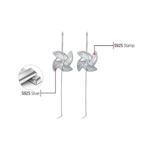 Detail showing the S925 silver stamp on windmill earrings and premium material quality