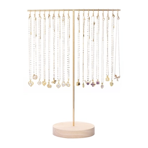 Golden iron necklace display stand with wooden base showing multiple pendants