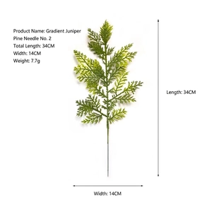 Macro detail of artificial pine branch showing 34cm height and gradient green needle texture