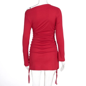 Detail showing red ribbed knit fabric and adjustable side drawstring ruched design