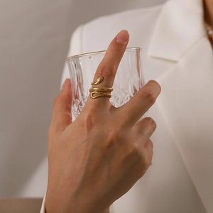 Detail of 18K gold plated snake ring showing intricate scale textures and wrap design