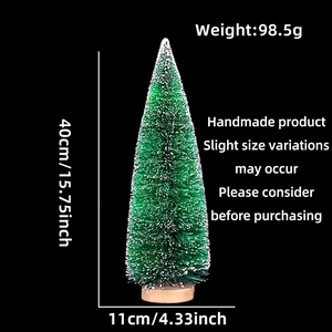 Miniature green cedar Christmas tree with white snow dusting and natural wooden base